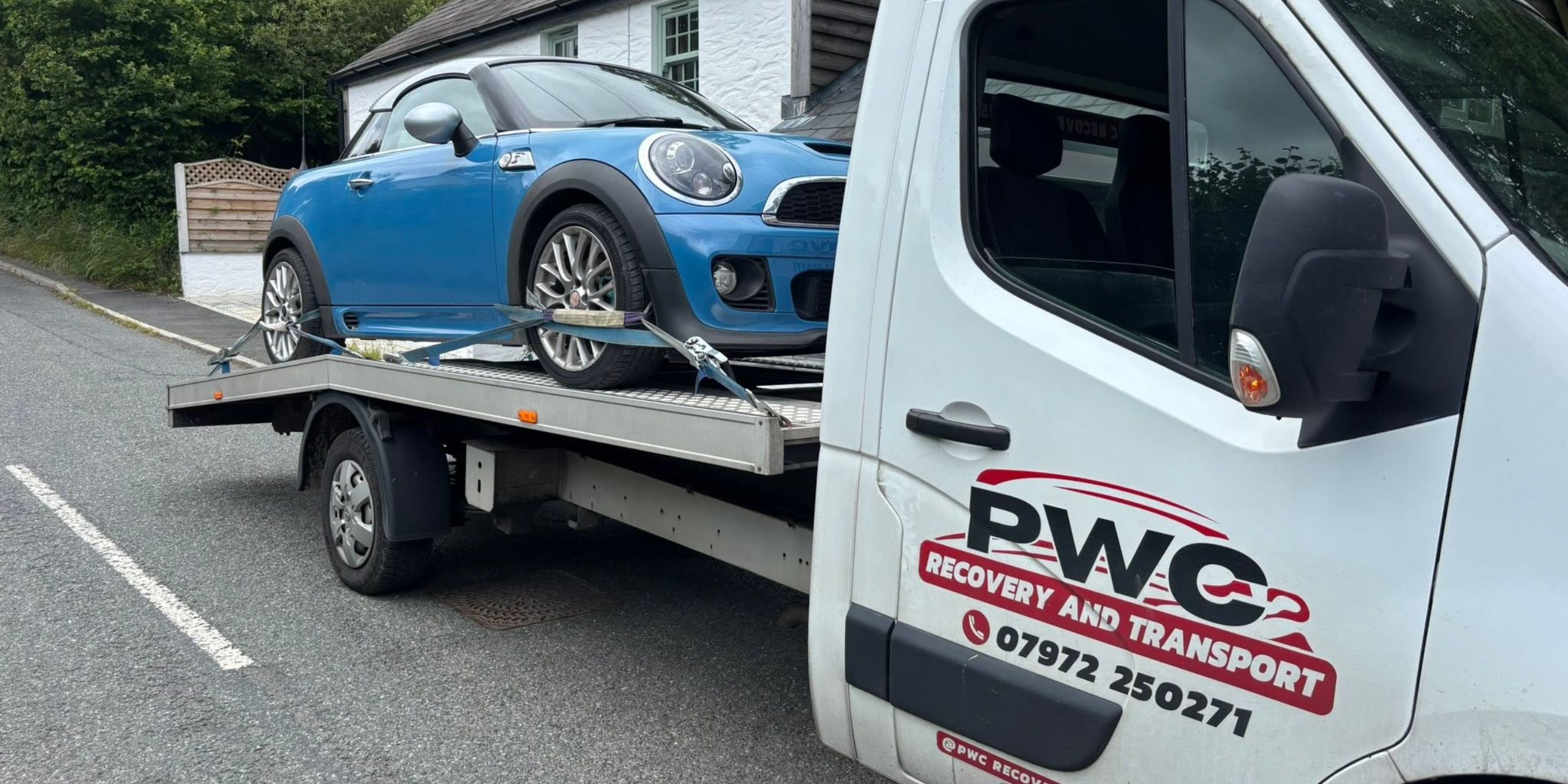 Blue Mini being recovered by PWC Recovery & Transport after a vehicle breakdown in South Wales